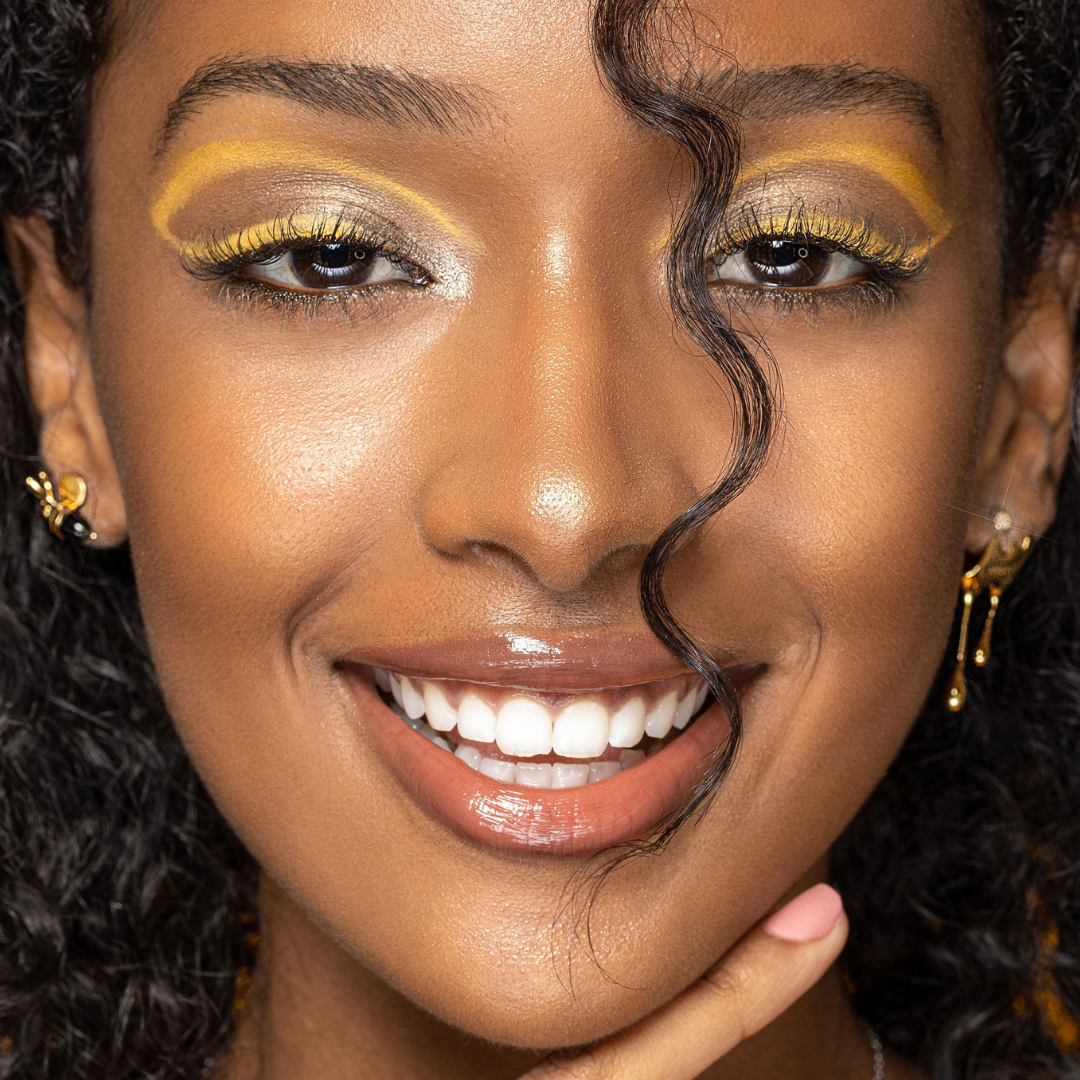 Artistic bee stud earring with gold honey splash design

