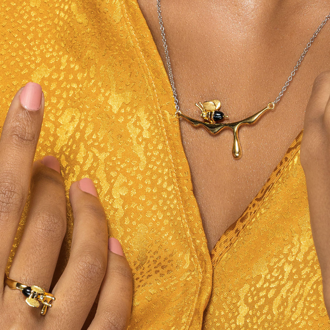 Stylish gold bee jewelry with droplet-shaped pendant accent

