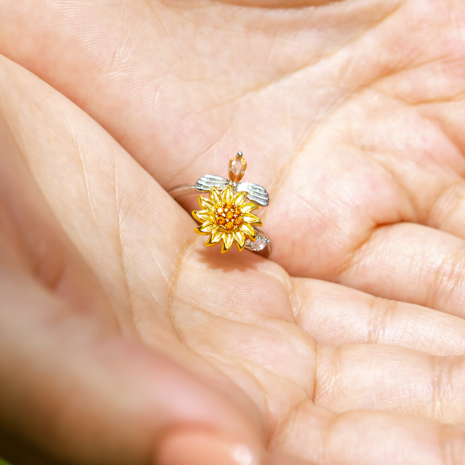Elegant sunflower and bee open ring with yellow gemstones

