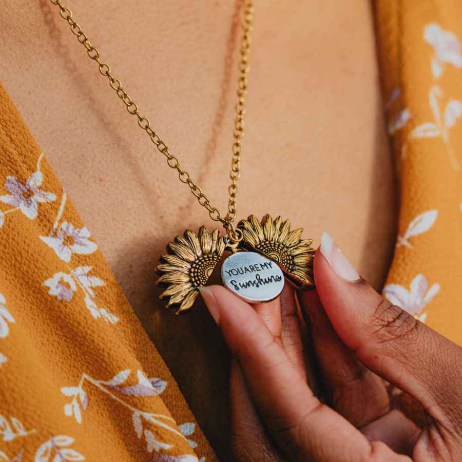 Romantic sunflower locket jewelry with engraved heartfelt message inside









