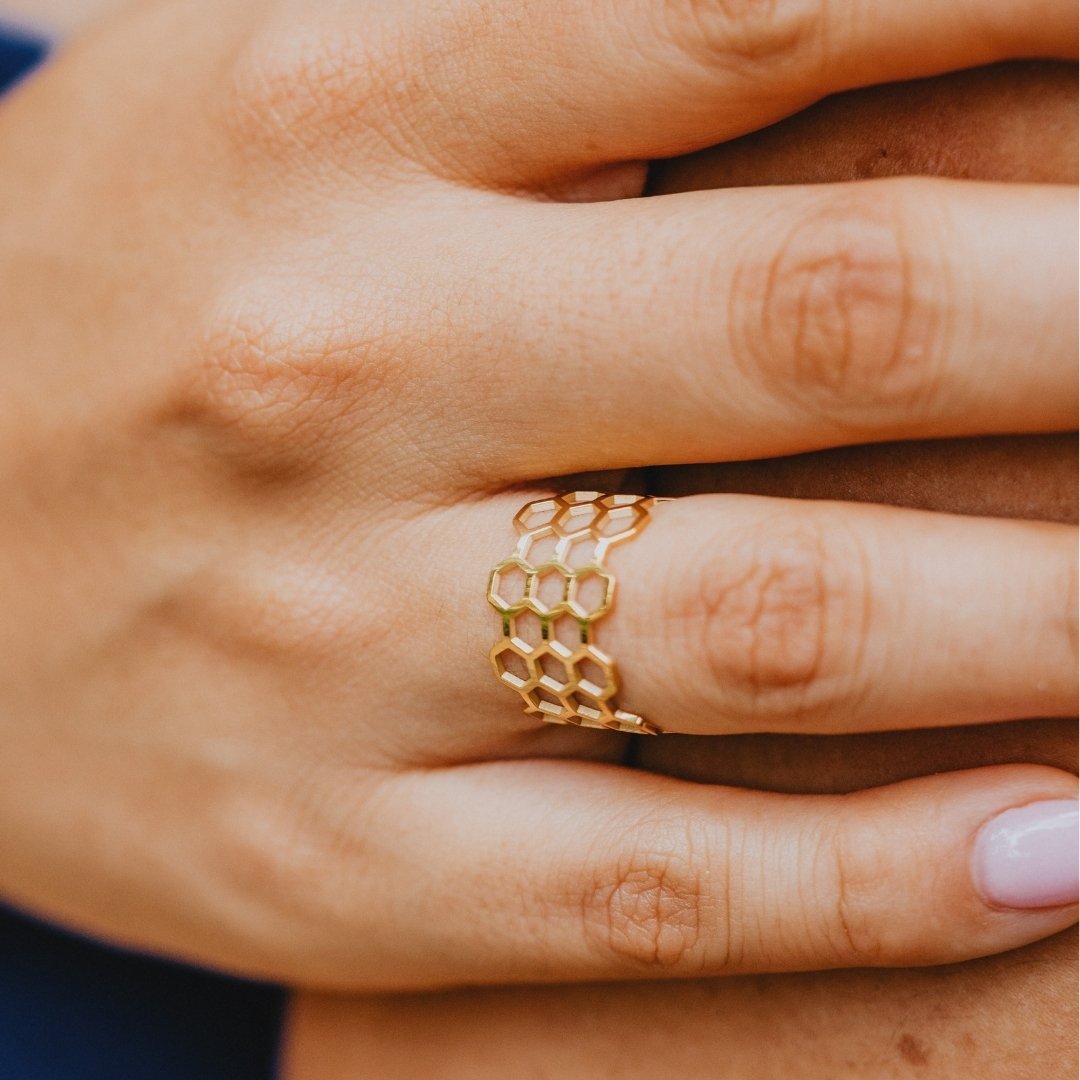 Bold geometric honeycomb bangle with gold finish

