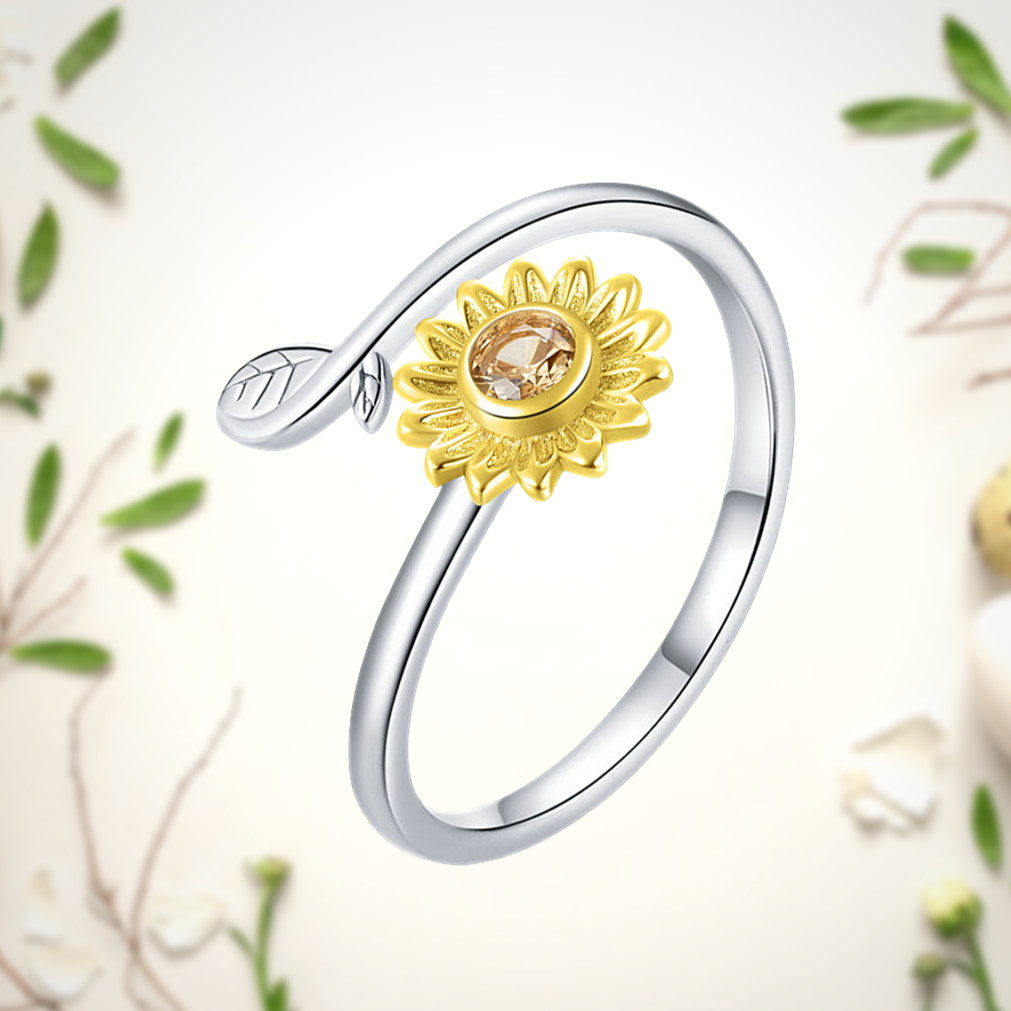 Elegant silver sunflower ring with gold petals and crystal center

